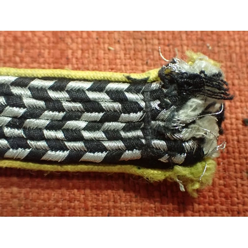 10 - WW2 German SA SHOULDER STRAP

YELLOW EDGED SLIM STRAP WITH ALUMINIUM WIRE AND BLACK FACING. 123 MM L... 