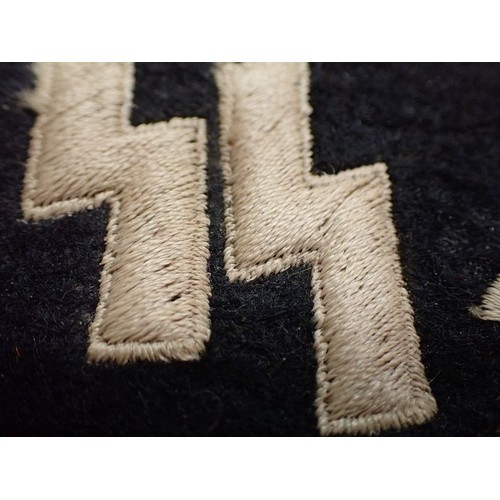 50 - 3rd Reich SS-VT Germania collar tab

Slight darkening to the white thread and light wear. 81 mm acro... 