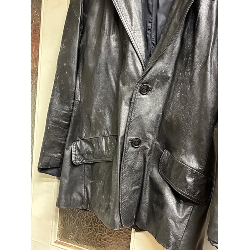 58 - Vintage Black Leather Coat

Has dirt from long term storage but appears major damage free - around s... 