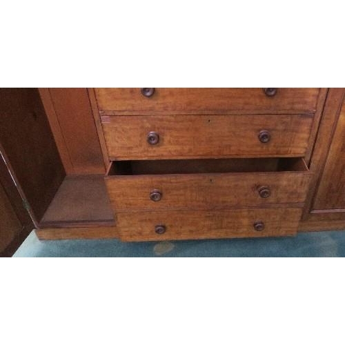 104 - A 19th century mahogany sentry box wardrobe, fitted with five long drawers over one deep long drawer... 