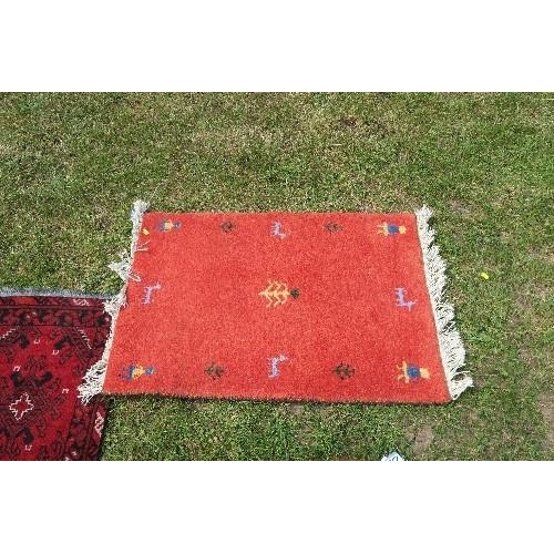 118 - TWO SMALL RED GROUND RUGS, 39INS X 18INS AND 19.5INS X 24INS, TOGETHER WITH ANOTHER RUG, 37INS X 24I... 