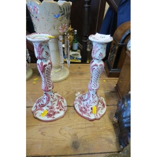 145 - A PAIR OF DELFT CANDLE STICKS, HEIGHT 10.5INS,  TOGETHER WITH A PAIR OF BRASS CANDLE STICKS, HEIGHT ... 