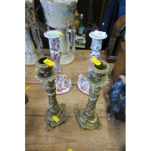 145 - A PAIR OF DELFT CANDLE STICKS, HEIGHT 10.5INS,  TOGETHER WITH A PAIR OF BRASS CANDLE STICKS, HEIGHT ... 