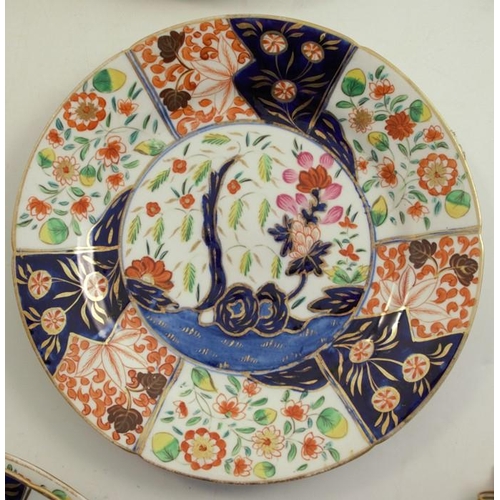 148 - A 19th century Coalport part service, decorated in the Tree of Life pattern in Imari colours, twelve... 