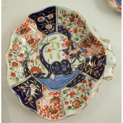 148 - A 19th century Coalport part service, decorated in the Tree of Life pattern in Imari colours, twelve... 