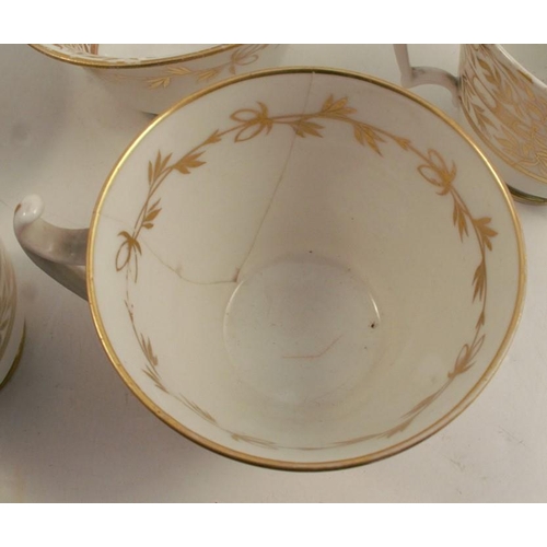 169 - Two 19th century English porcelain part tea services, both decorated in gilt on white, one set compr... 