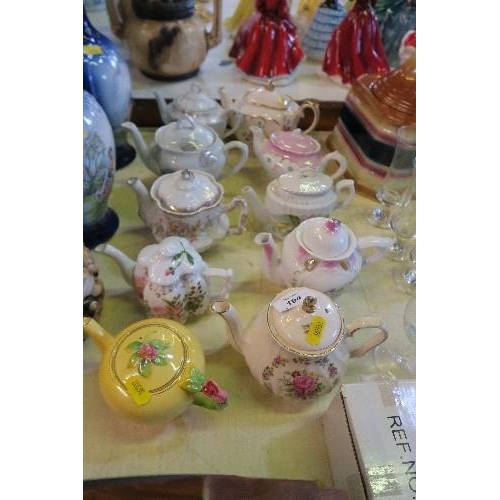 194 - A COLLECTION OF TEAPOTS (10)