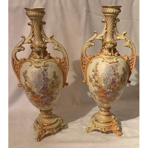 200 - A pair of 19th century continental blush ivory vases, decorated with flowers, height 18ins