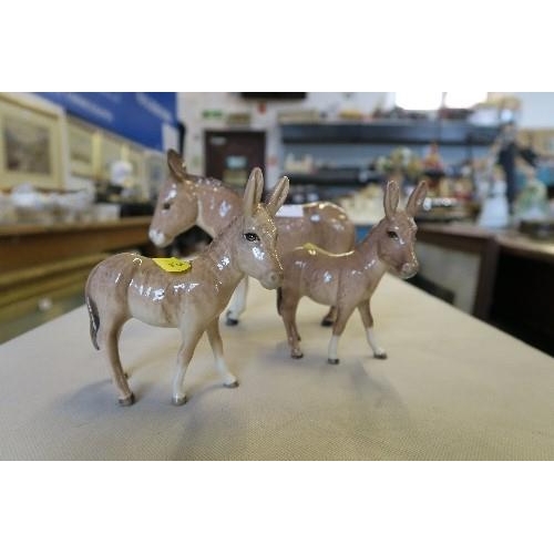 215 - 3 BESWICK MODELS OF DONKEYS, HEIGHTS 5.75INS AND DOWN