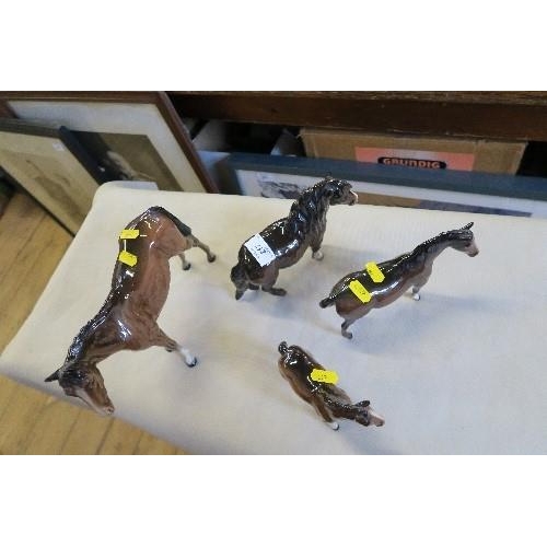 217 - 4 BESWICK MODEL HORSES, INCLUDING THREE BAY HORSES AND A BAY PONY, HEIGHTS 8INS AND DOWN