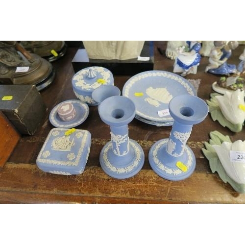 229 - A COLLECTION OF WEDGWOOD JASPERWARE, INCLUDING CANDLE STICKS, CHRISTMAS PLATES, ETC.