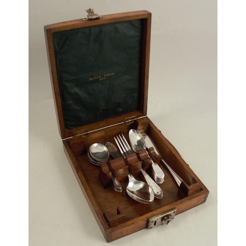 247 - An early 20th century silver plated part set of cutlery, in an oak carry case, the lid interior viny... 