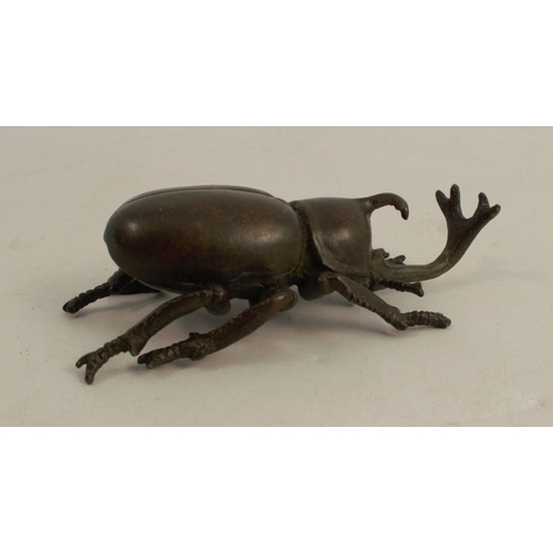 254 - A modern Japanese style bronze model, of a beetle, signed, length 2.75ins