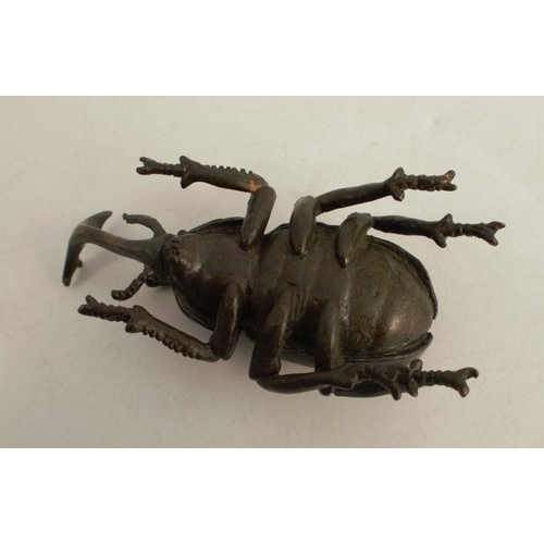 254 - A modern Japanese style bronze model, of a beetle, signed, length 2.75ins