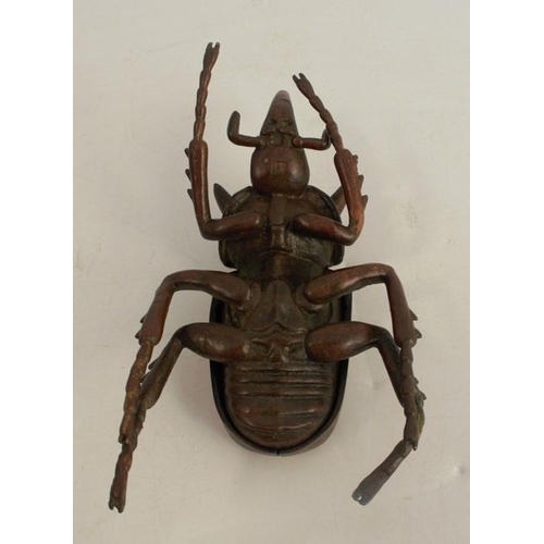 257 - A modern Japanese style bronze model, of a stag beetle, with hinged back, signed, length 4.5ins