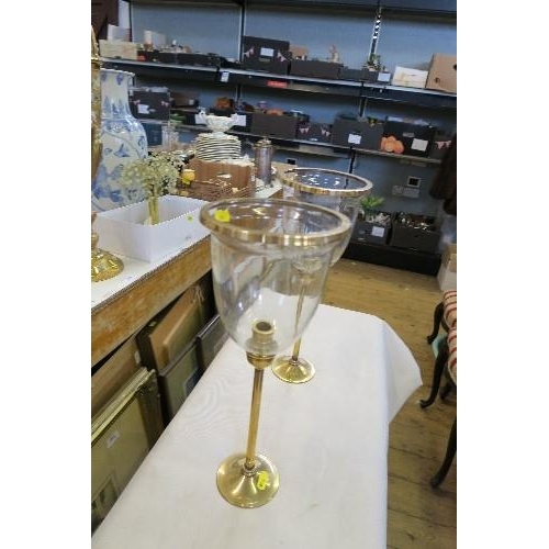 288 - A PAIR OF BRASS AND GLASS CANDLE STANDS, OF GOBLET FORM, HEIGHT 16INS X DIAMETER 6.25INS