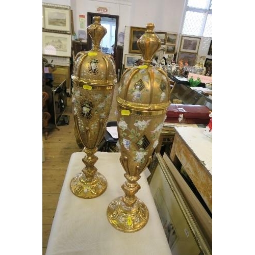 289 - A PAIR OF ORNATE GILT COVERED GLASS VASES, HEIGHT 24INS