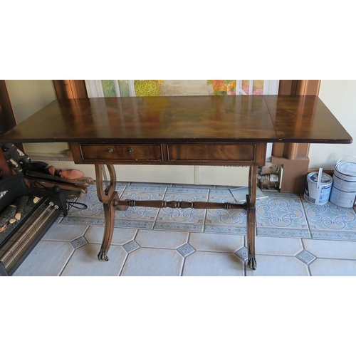 71 - A mahogany sofa table, fitted with two real and two dummy frieze drawers, raised on end lyre support... 