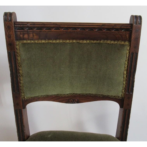 87 - A set of six Edwardian oak dining chairs, with moulded sides, and cotton reel turned legs united by ... 