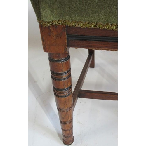 87 - A set of six Edwardian oak dining chairs, with moulded sides, and cotton reel turned legs united by ... 