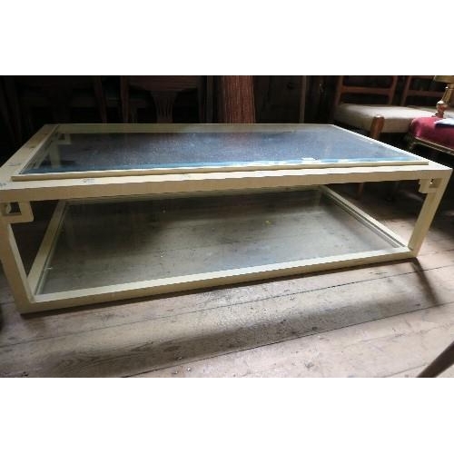 95 - A GLASS TOP COFFEE TABLE, 55INS X 29INS X HEIGHT 15INS