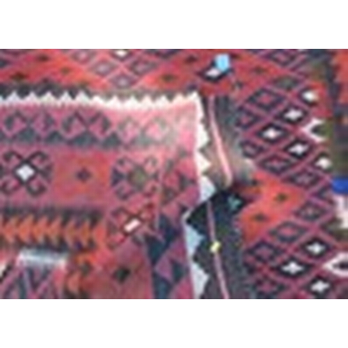 120 - A Kilim rug, decorated with repeating stepped diamonds to the field, 74ins x 120ins