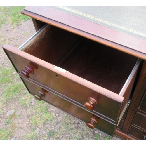 34 - A 19th century mahogany pedestal desk, with tooled leather writing surface, having an arrangement of... 