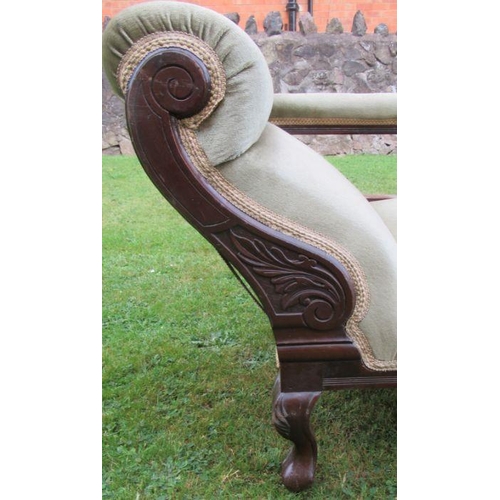 39 - A late 19th century mahogany and upholstered chaise longue, with pierced carved uprights, raised on ... 