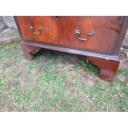 4 - A mahogany and walnut tallboy, fitted with two short drawers over two long drawers to the top sectio... 