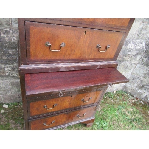 4 - A mahogany and walnut tallboy, fitted with two short drawers over two long drawers to the top sectio... 