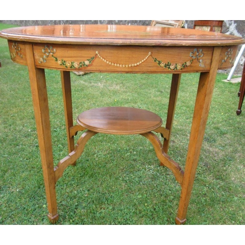 44 - An Edwardian satinwood oval occasional table, decorated to the top and frieze with putti and flowers... 