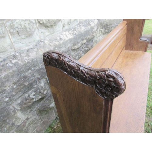 45 - An oak church pew, width 63ins x height 39ins