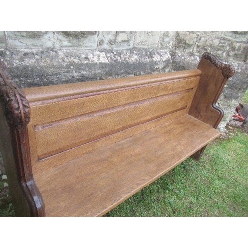 45 - An oak church pew, width 63ins x height 39ins