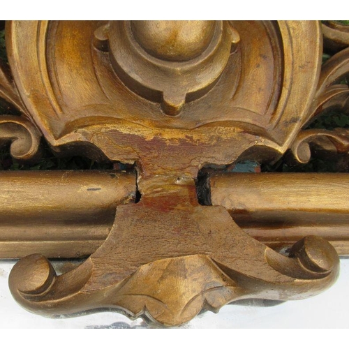 59 - A gilt framed over mantel mirror, of rectangular form, with scroll and leaf decoration, overall dime... 