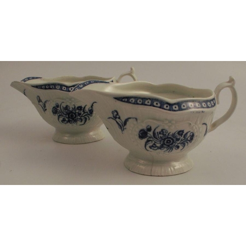 732 - A pair of First Period Worcester blue and white sauce boats, decorated with flowers to an embossed b... 