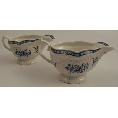 732 - A pair of First Period Worcester blue and white sauce boats, decorated with flowers to an embossed b... 