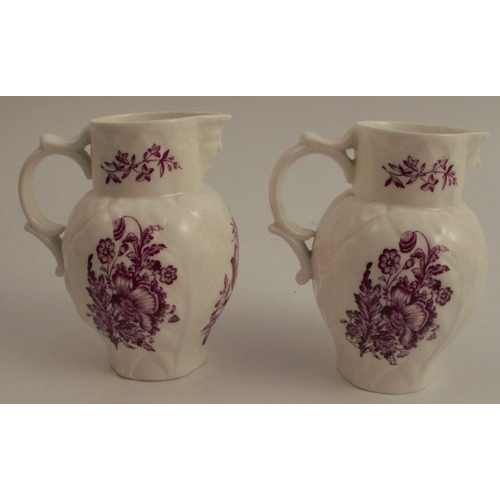 733 - A pair of Royal Worcester leaf moulded jugs, with mask spouts, the moulded body decorated with purpl... 