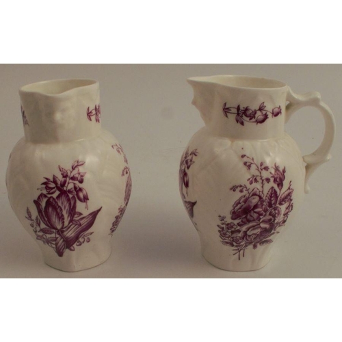 733 - A pair of Royal Worcester leaf moulded jugs, with mask spouts, the moulded body decorated with purpl... 