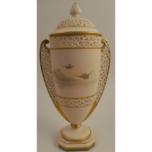 734 - A Grainger & Co Royal China Works Worcester reticulated ivory vase and cover, decorated with a view ... 