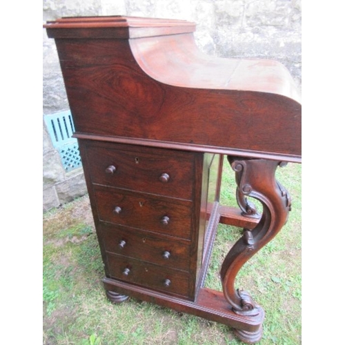 2 - A 19th century rosewood piano top Davenport, having secret writing compartment and rising lid, openi... 