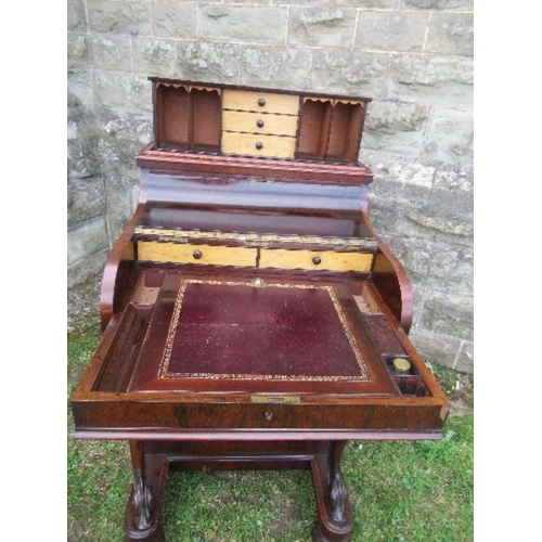 2 - A 19th century rosewood piano top Davenport, having secret writing compartment and rising lid, openi... 