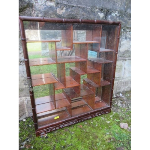 20 - An Eastern hardwood  hanging display cabinet, height 23ins, width 19ins