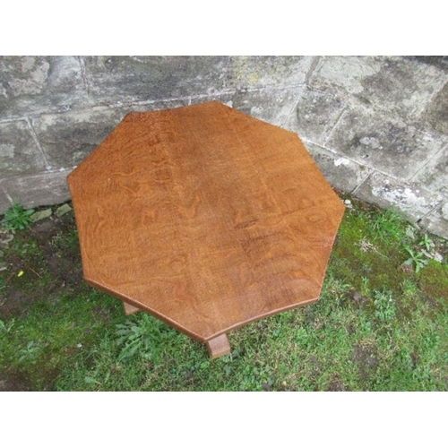 23 - A Robert Mouseman Thompson oak octagonal occasional  table, with adzed finish, height 19ins, diamete... 