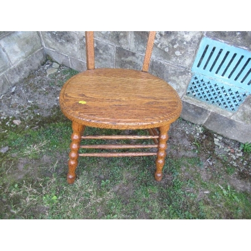 19 - An unusual Arts and Crafts style high ladder back oak chair, max height 49ins, seat width 19ins