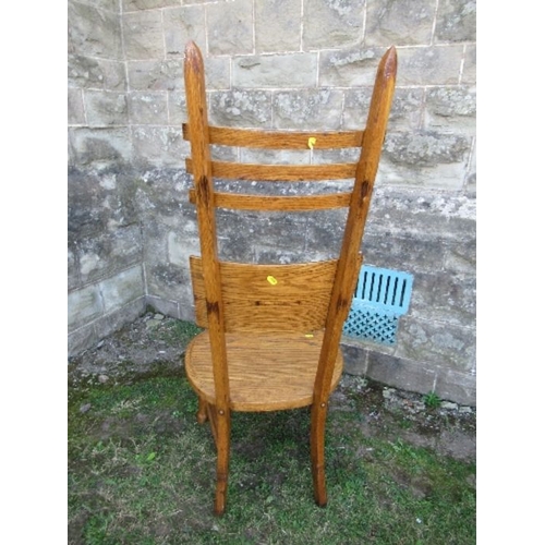 19 - An unusual Arts and Crafts style high ladder back oak chair, max height 49ins, seat width 19ins