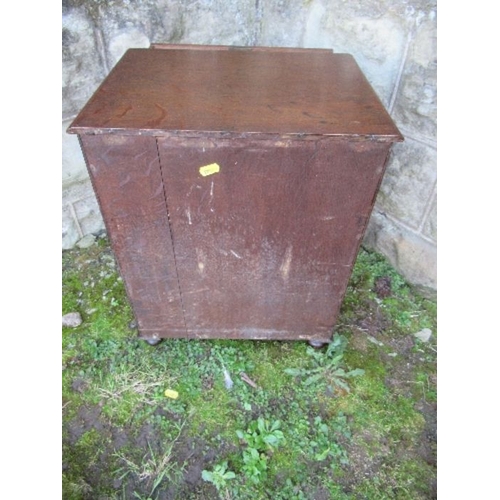 28 - A 19th century late Georgian oak miniature chest of drawers, having five graduated drawers with ebon... 