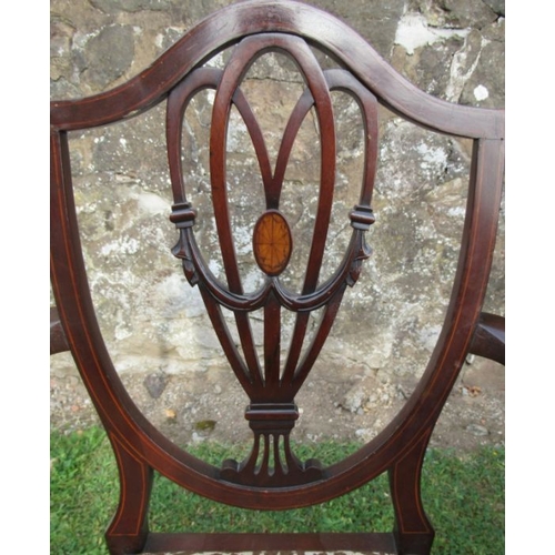 40 - A set of eight (6+2) mahogany shield back dining chairs, with carved, pierced and inlaid decoration ... 