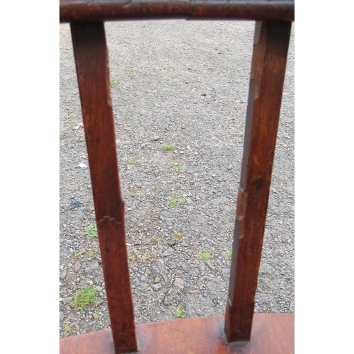 33 - A mahogany desk chair, the curved back with upholstered upper section, raised on turned spindles and... 