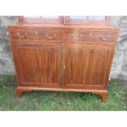 14 - A 19th century design mahogany glazed cabinet, the upper section having glazed doors opening to reve... 