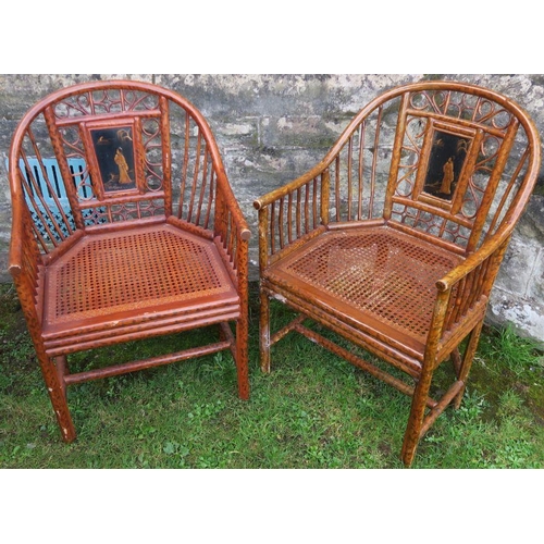 12 - Two Oriental design bamboo effect armchairs, with lacquered panel and cane seats